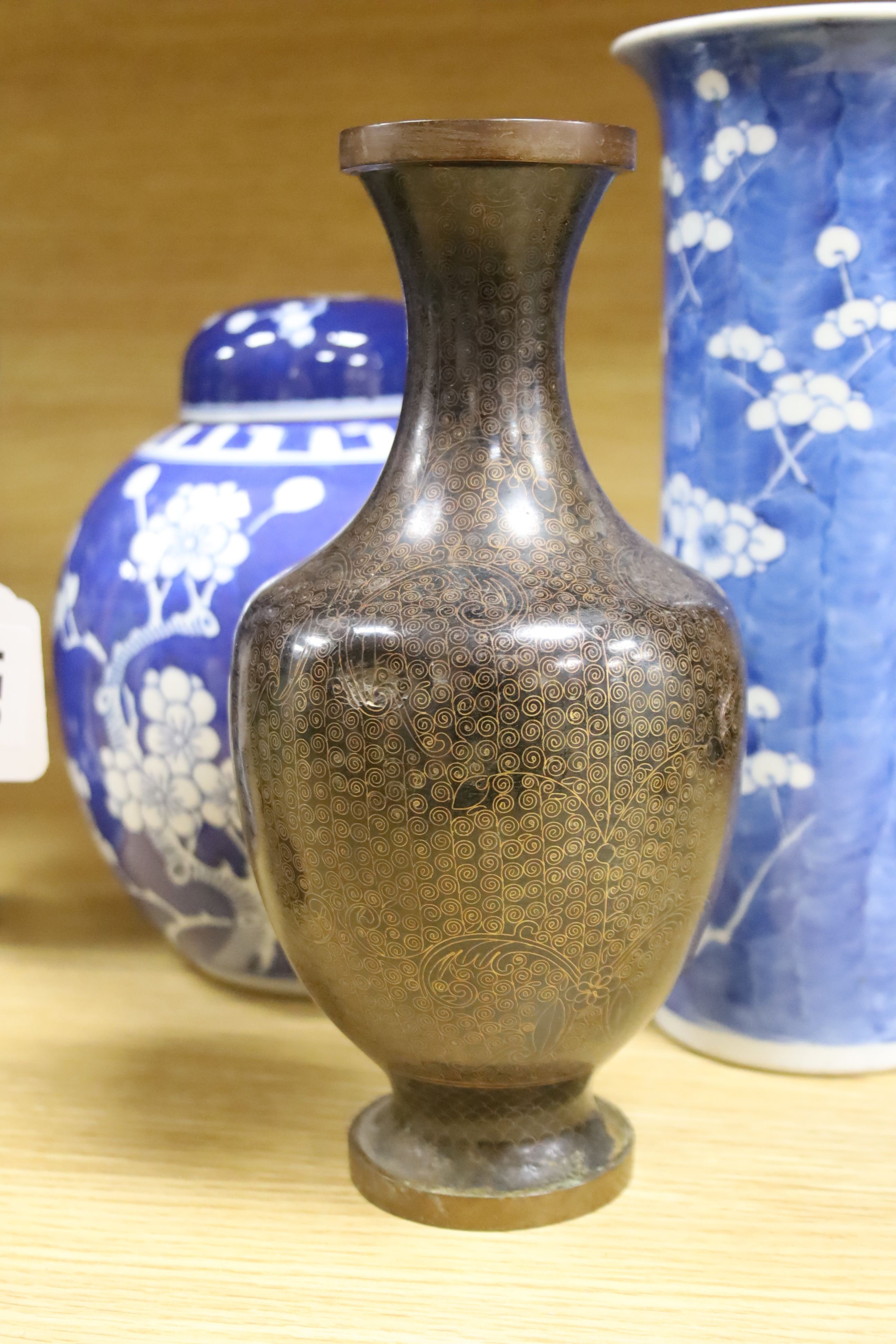 A Chinese blue and white cylindrical vase, another vase and cover and a blue and white jar and cover, together with a cloisonne vase and a bronze censer, tallest 32cm